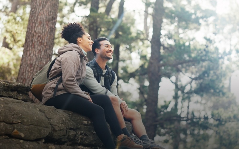 a couple outdoors in a nature-filled area
