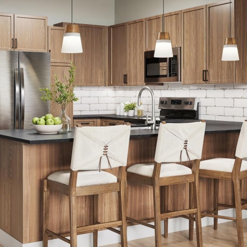 a kitchen with a bar and chairs