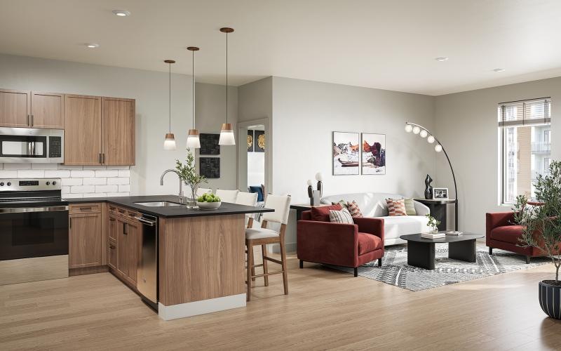 a large kitchen with a couch and a table